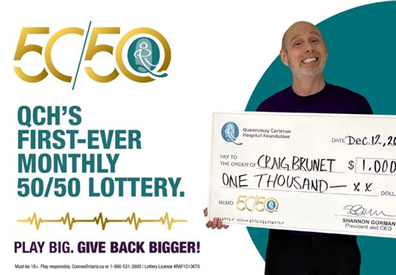 50/50 lottery, man holding big cheque